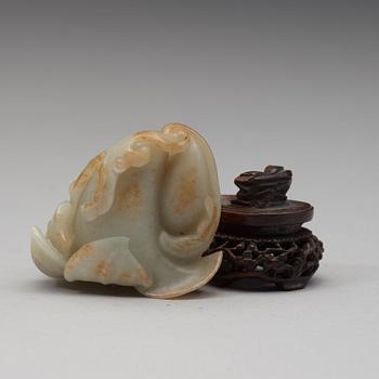 A celadon nephrite floral group, Qing dynasty (1644-1944).