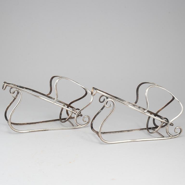 A pair of plated bottle stands, 20th century.