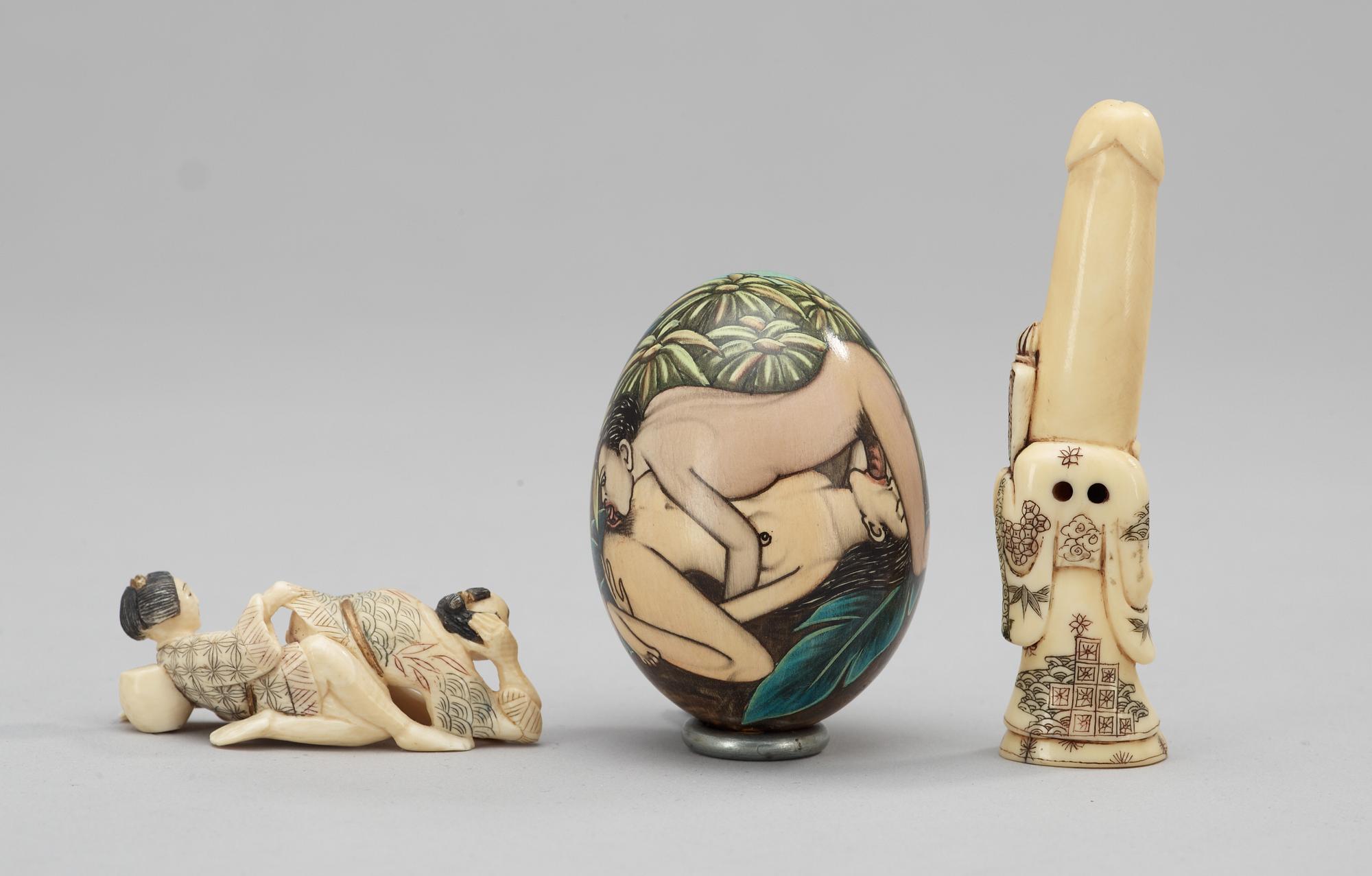 Two bone Japanese netsukes and wooden egg, 19th century.