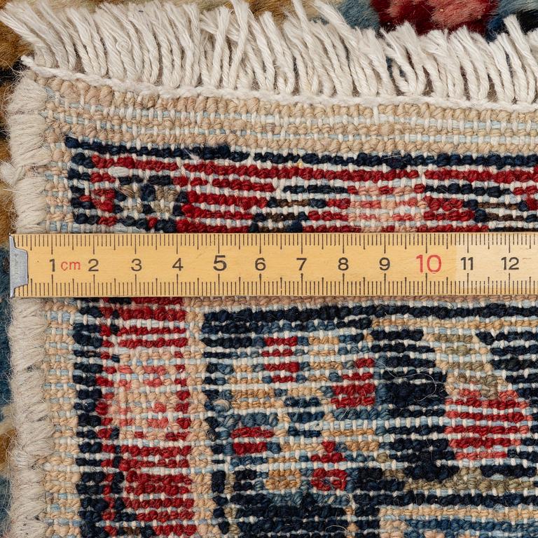 An oriental carpet, c. 370x260 cm.