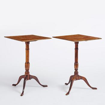 A pair of alder-veneered tilt-top tables by C. Hollst (master 1787-1830).