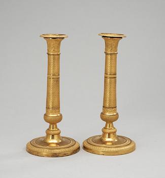 A pair of Empire candlesticks, 19th Century.