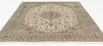 A Keschan carpet, signed, c. 350 x 245 cm.