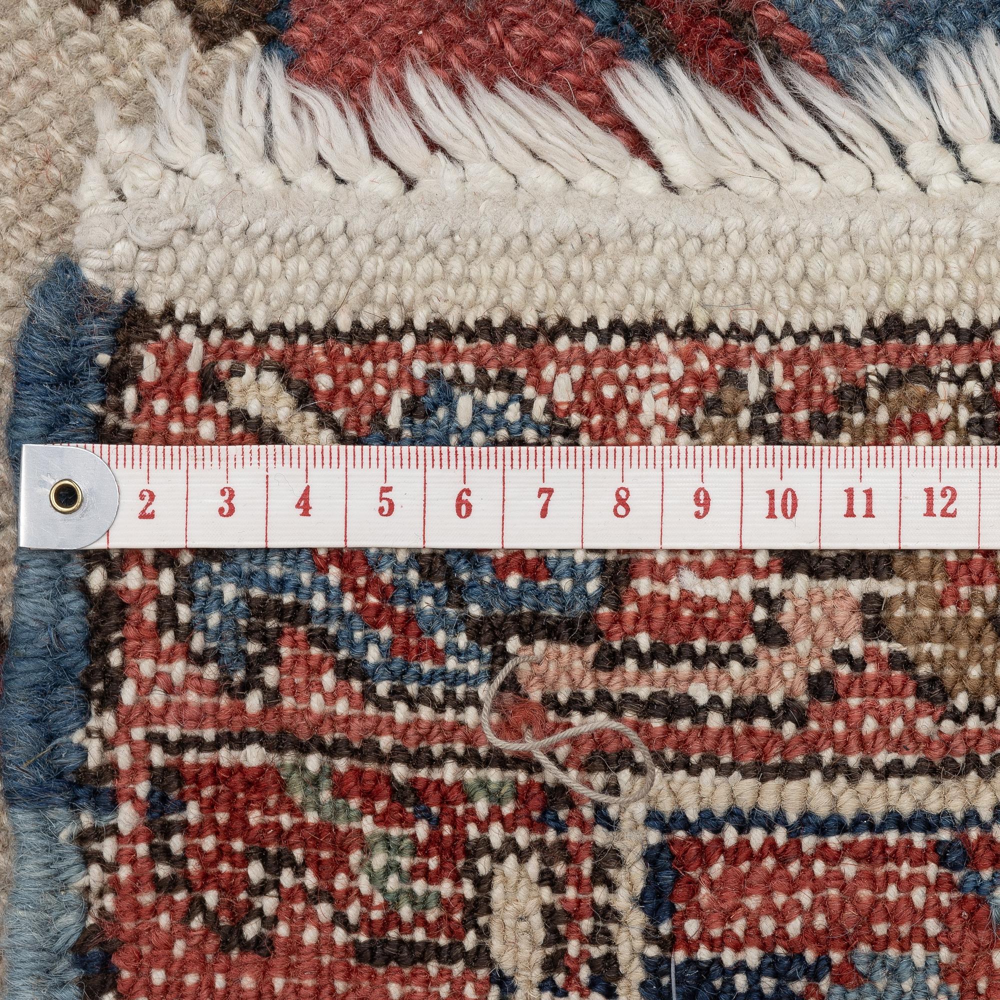 An Antique north west persian carpet, c. 325 x 313 cm.
