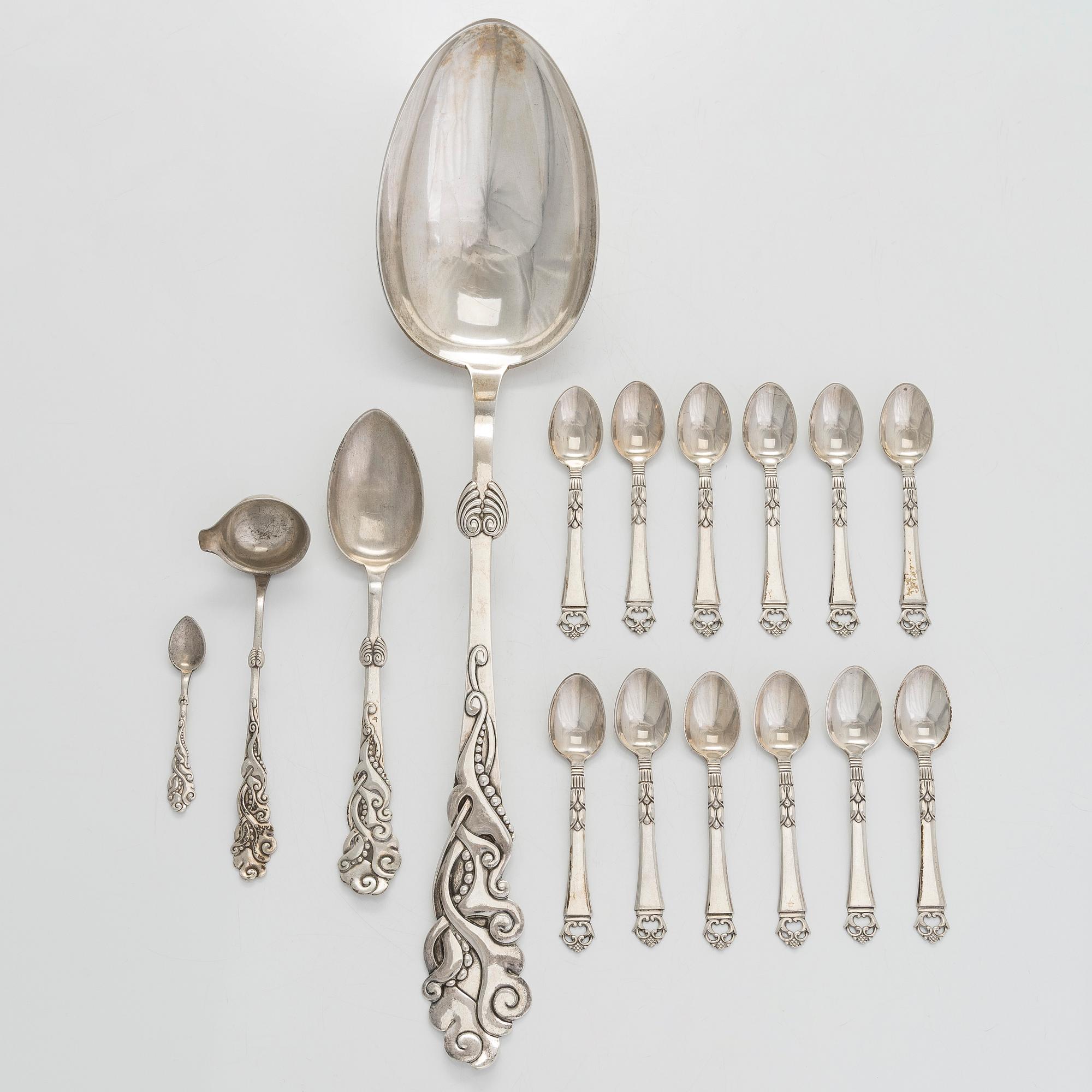 A set of  four silver serving spoons, with a set of 12 coffee spoons, Denmark, early and first half of the 20th century.