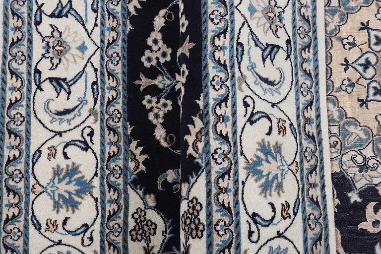 A carpet, Nain, part silk, ca 256 x 199 cm.