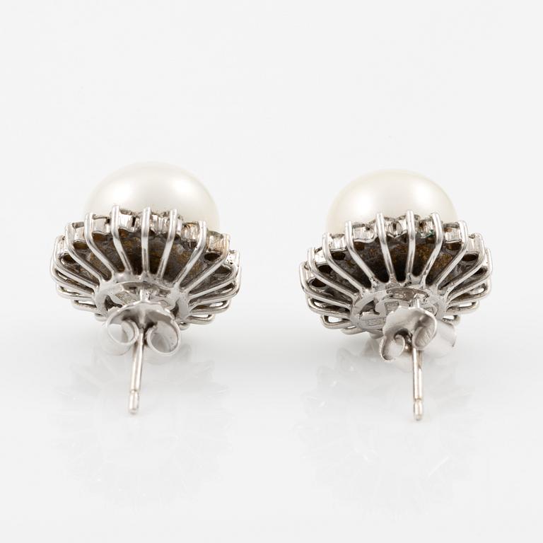 Earrings, a pair, 18K white gold with cultured pearls and brilliant-cut diamonds.