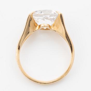 Ring, 18K gold with a synthetic white stone.