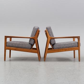 A pair of USA 75, teak lounge chairs by Folke Ohlsson for Dux.