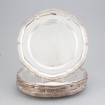 A set of twelve rococo-style silver plates, mark of GAB, Stockholm 1947.