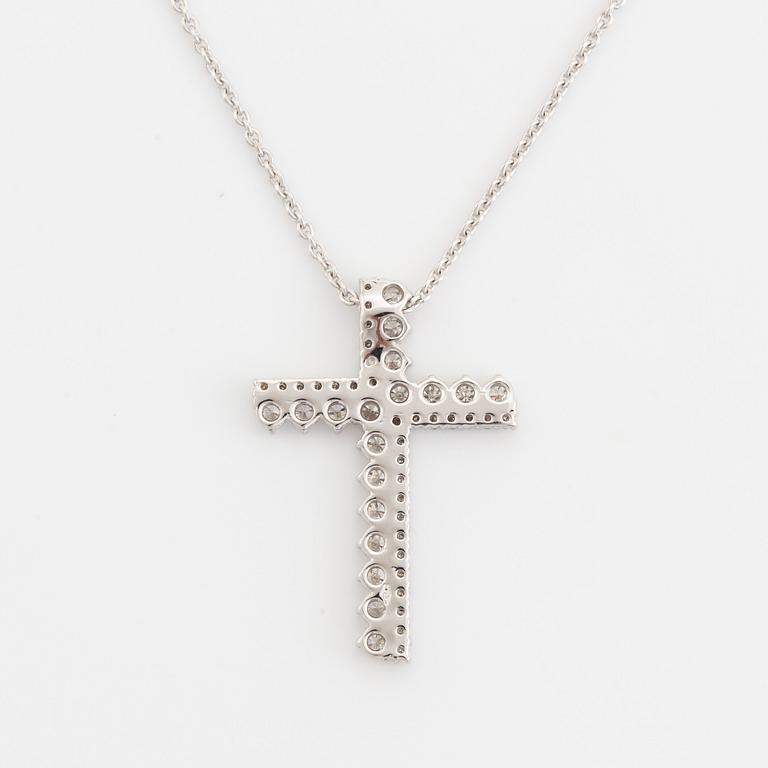 Brilliant cut diamond cross necklace.