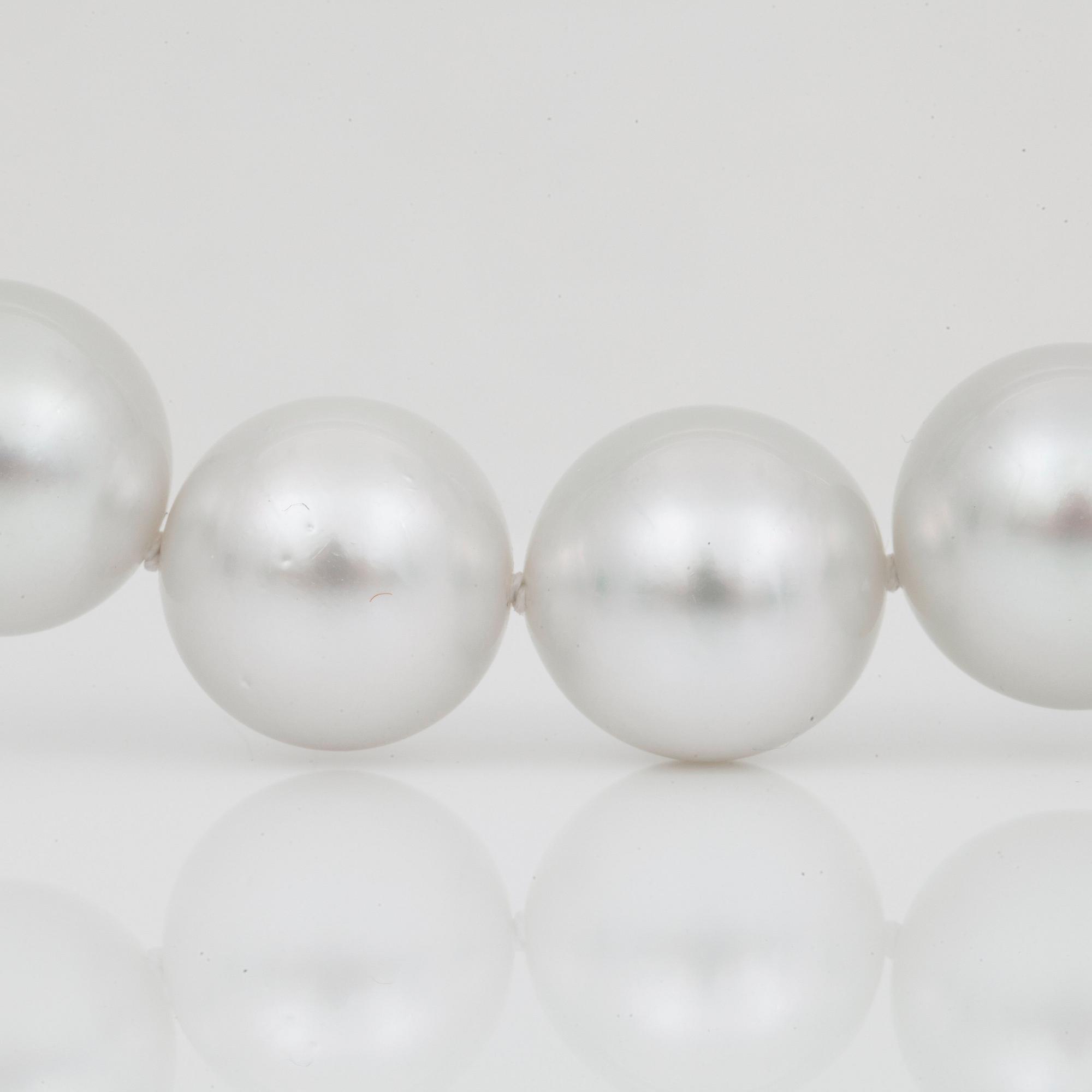 A cultured South Sea pearl necklace, Ø 12-14 mm, with a diamond-set clasp.