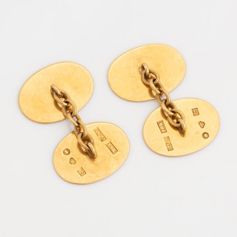 18K gold cufflinks with monogram.