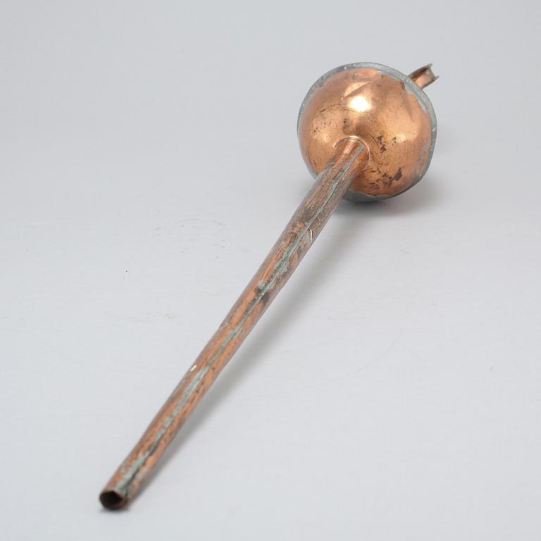 A 19th century pipette in copper.