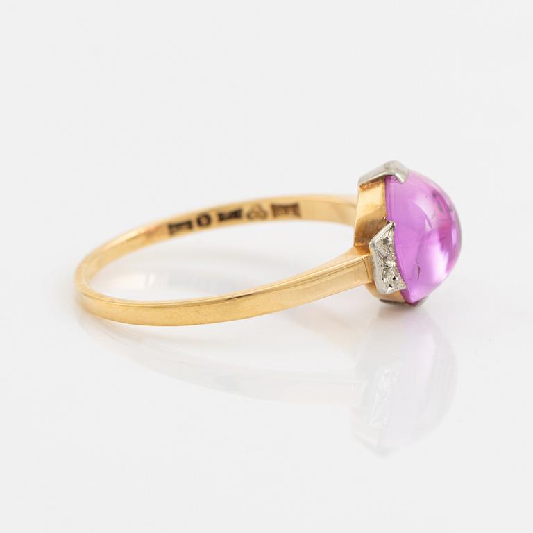 18K gold and cabochon cut syntehtic pink sapphire.