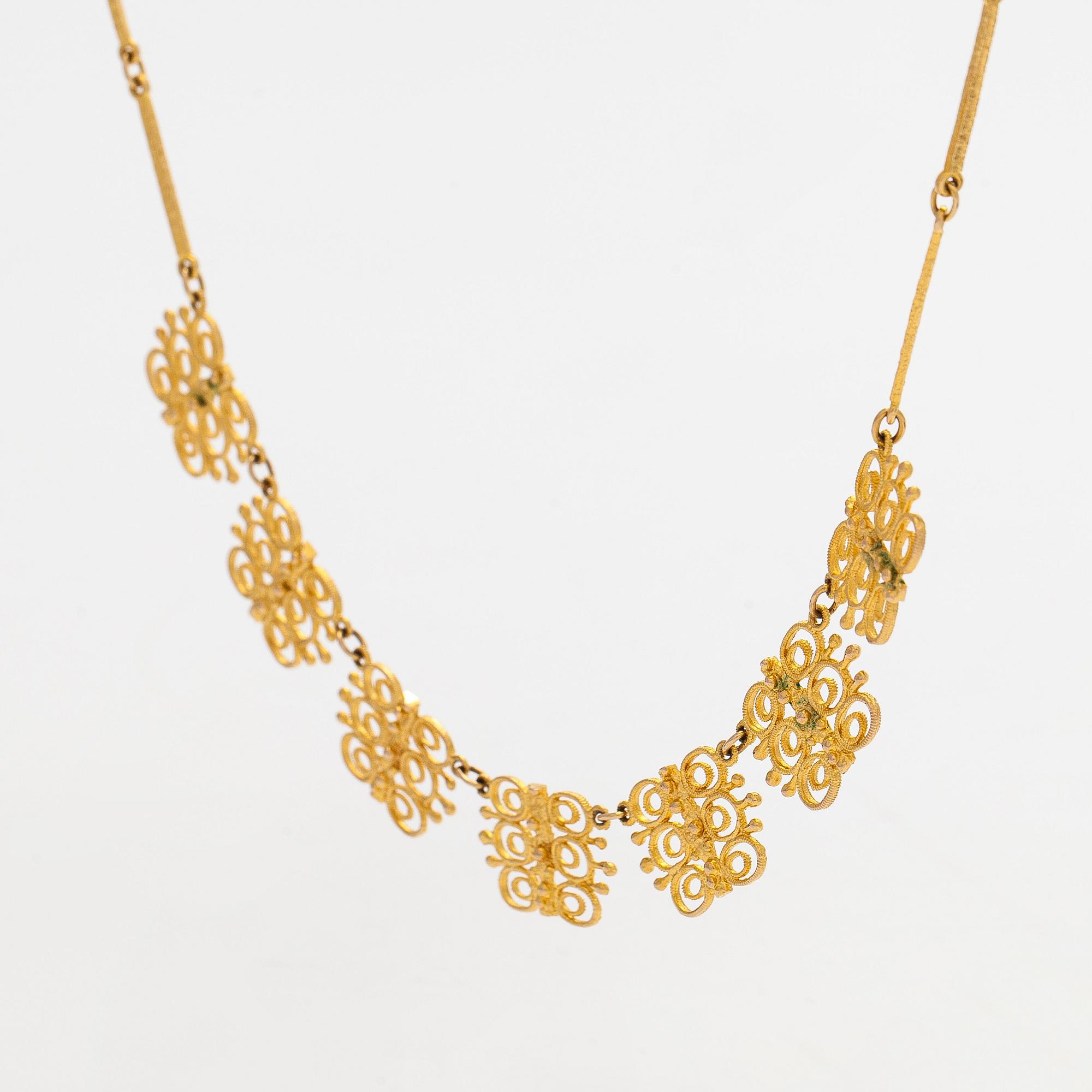 Esko Raitanen, collier, armband och örhängen, 14K guld, Helsingfors 1972.
