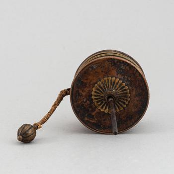 A Tibetan prayer roll and a metal roll with compartments with prayer rolls, 19th Century.