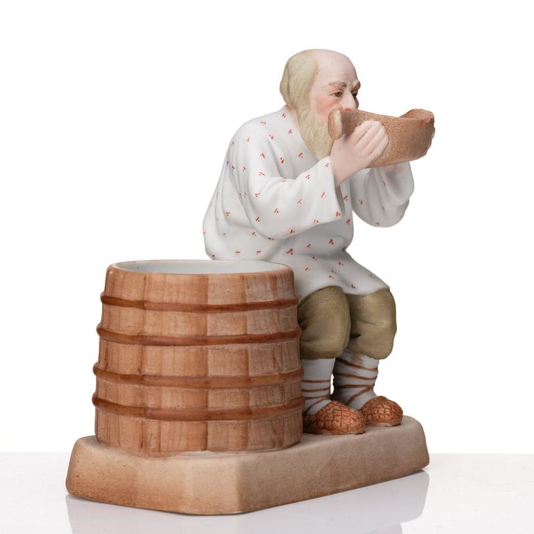 A Russian Gardner bisquit porcelain figure of a peasant, Moscow, 19th Century.