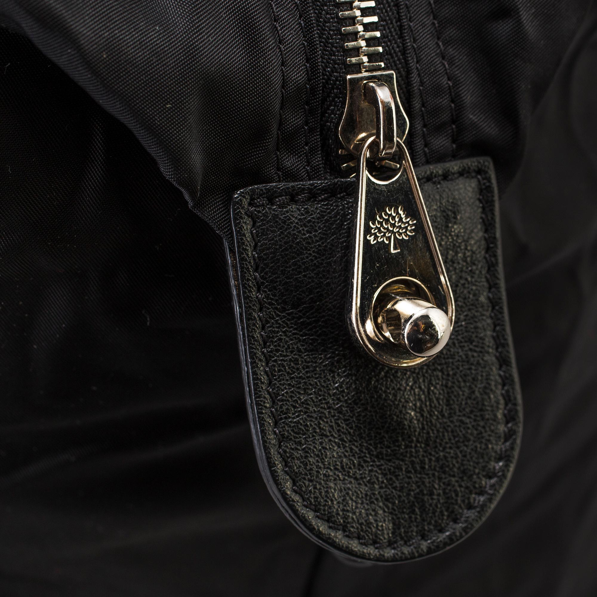 A foldable Mulberry weekend bag.