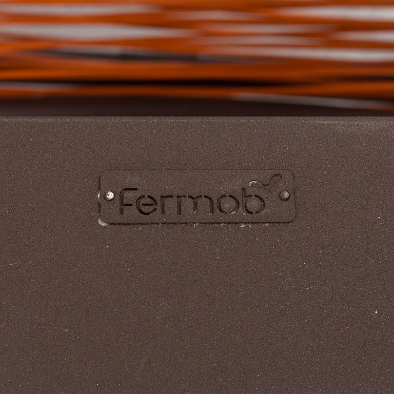 a pair of FRÉDÉRIC SOFIA "Saint Tropez" lounge chairs with footstools, by Fermob.