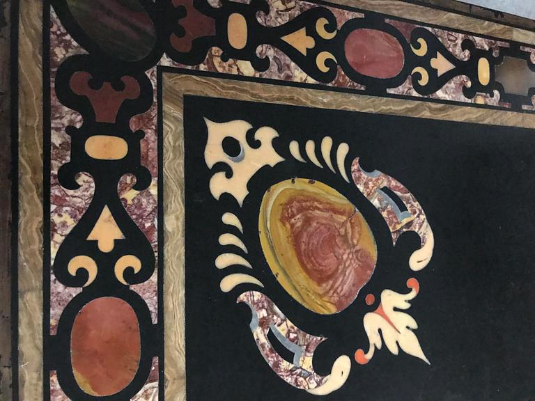 A pietre dure top, Italy, circa 1900, probably Rome or Naples. The stand in Louis XIV-style.