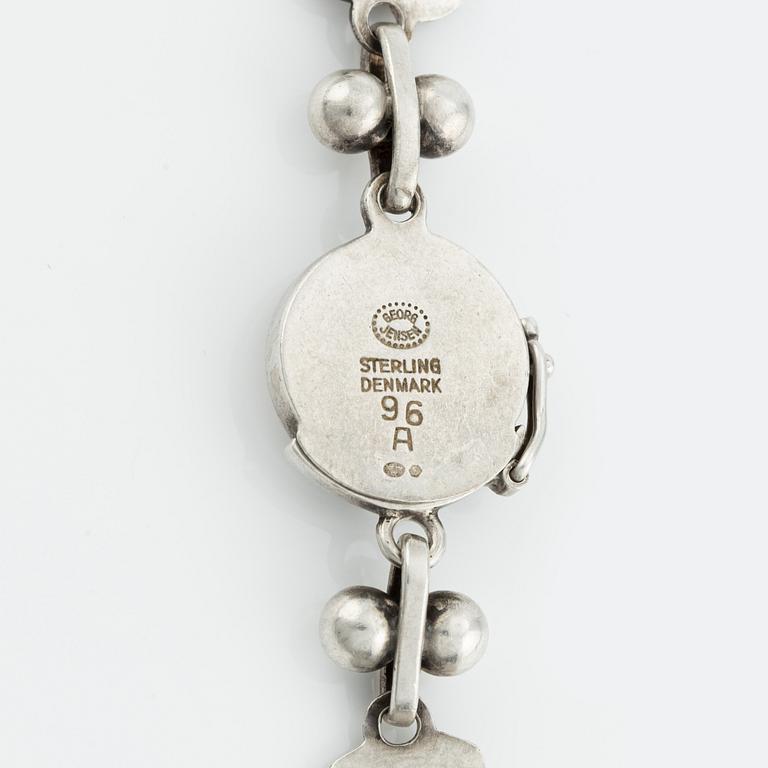 Harald Nielsen, a sterling silver necklace, a brooch, and a pair of earrings, for Georg Jensen, Denmark post 1945.