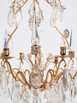 A Louis XV-style rock crystal eight-light chandelier, 20th century.