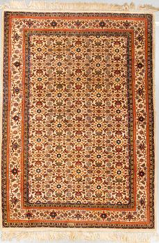 A rug, Old Tabriz, signed, ca 247 x 173 cm.