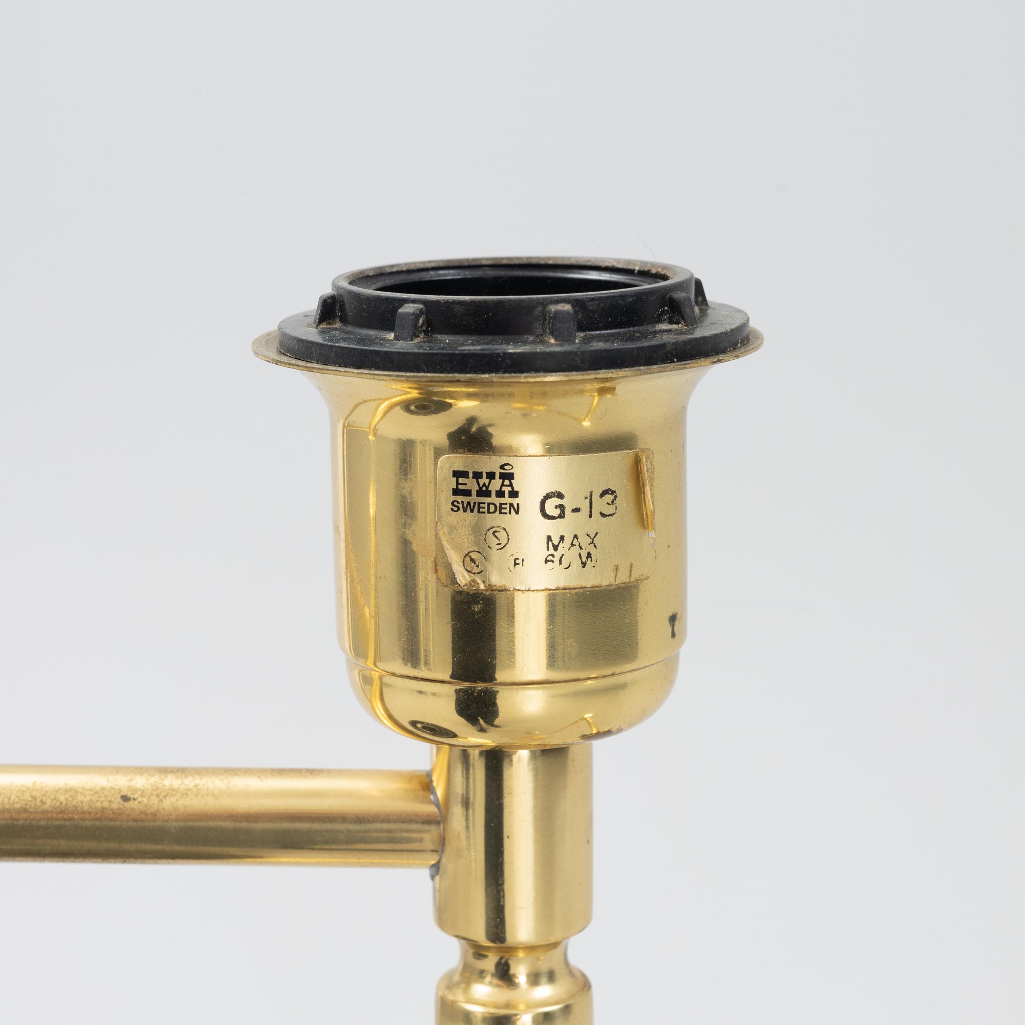 A pair of brass floor lamps, EWÅ, Sweden, second half of the 20th century.