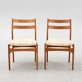 A dining table with six chairs, mid 20th century.