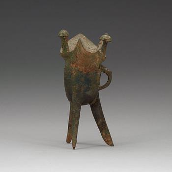 A bronze ritural tripod wine vessel 'Jue', presumably Shang dynasty, 12/11th Century BC.