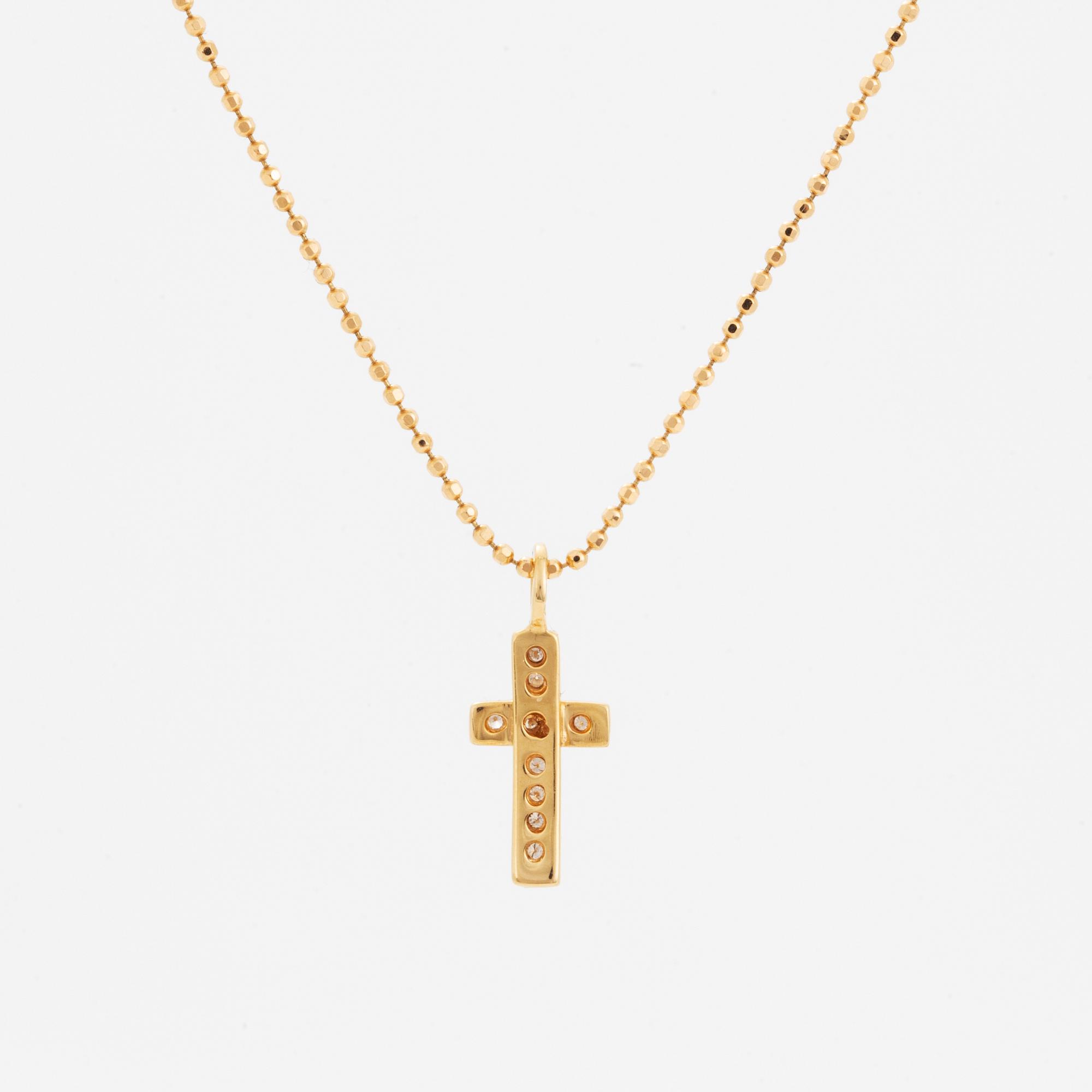 Efva Attling, 18K gold and brilliant-cut diamond cross pendant.