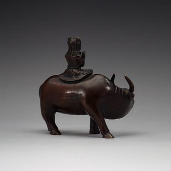 A bronze figure of a flute paying boy on a water buffalo, Qing dynasty (1644-1912).