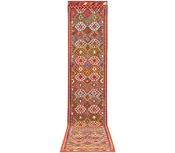 A Kilim carpet, c. 482 x 63 cm.