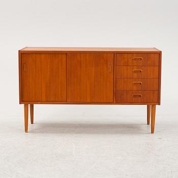 A 1950's teak veneered sideboard.