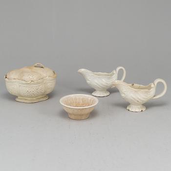 A creame weare buttertureen with cover, a cake mould and a pair of sauce boats, 18/19th Century, part Rörstrand.