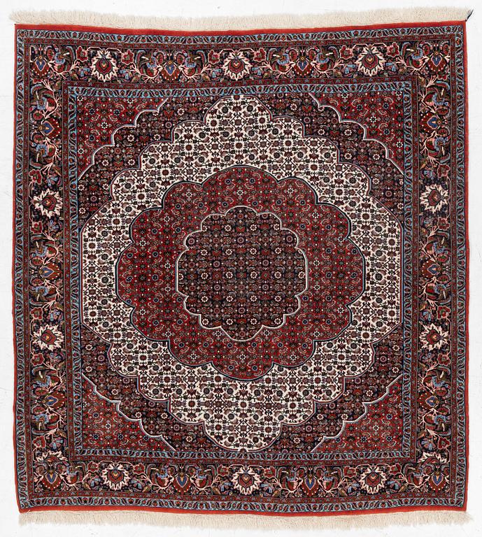 An Oriental rug, approx. 213 x 201 cm.