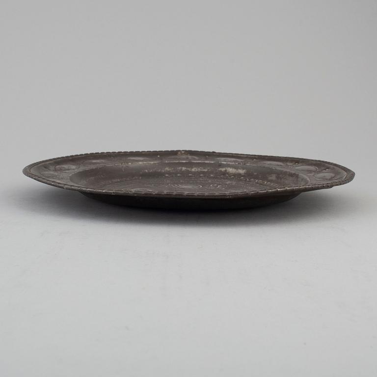 An 18th century pewter plate.