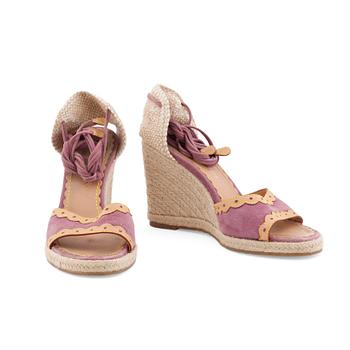 LOUIS VUITTON, a pair of straw and pink suede wedge sandals.