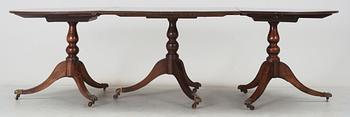 An English Regency and later mahogany dining table.