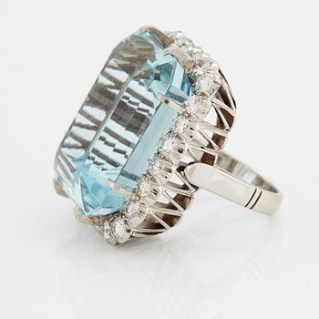 A RING set with an aquamarine and brilliant-cut diamonds.