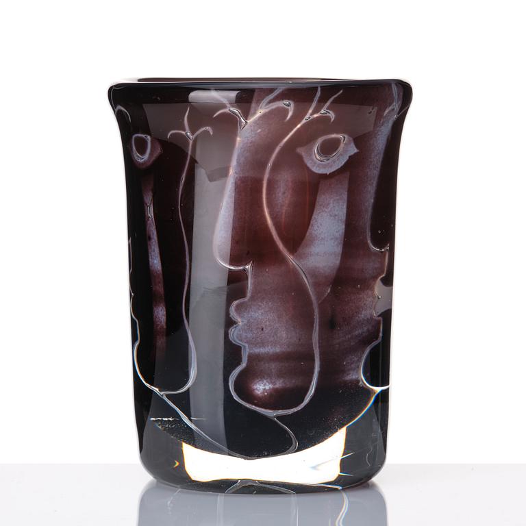 Ingeborg Lundin, an 'ariel' burgundy coloured glass vase decorated with faces, Orrefors Sweden 1972.