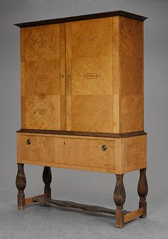 A Carl Malmsten "Haga" stained birch cabinet on stand, Nordiska Kompaniet ca 1924.