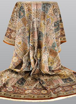 A silk Ghom carpet, 296 x 194 cm.