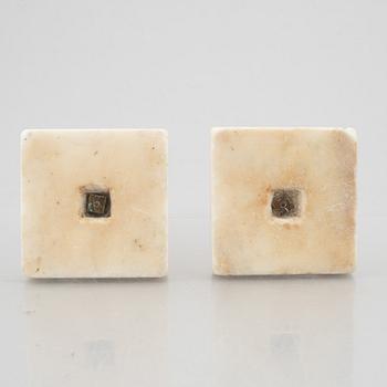 A pair of marble and gilt-bronze Louis XVI-style candelsticks, circa 1900.