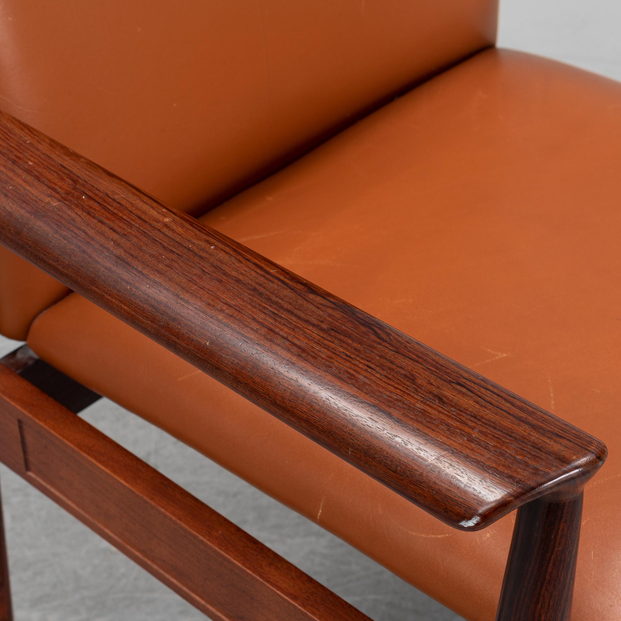 Finn Juhl, a rosewood easy chair, from Cado, Denmark, 1960's/70's.