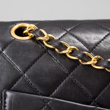 A "Double Flap bag" by Chanel.