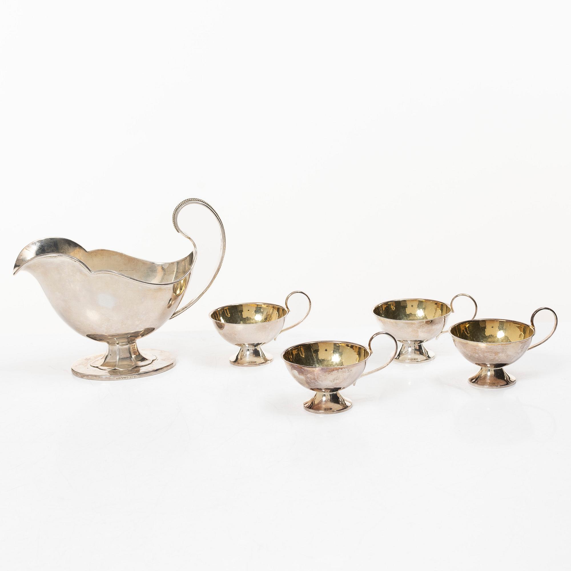 Sauceboat and four punch cups, silver, Sweden, 20th century.
