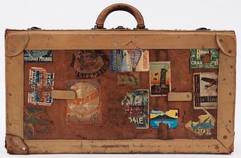 A late 19th cent leather suitcase by Louis Vuitton.