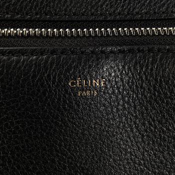 HANDBAG, "Large Edge Bag", Céline, 2013. Black leather with silver-tone hardware, pocket at back with snap closure.